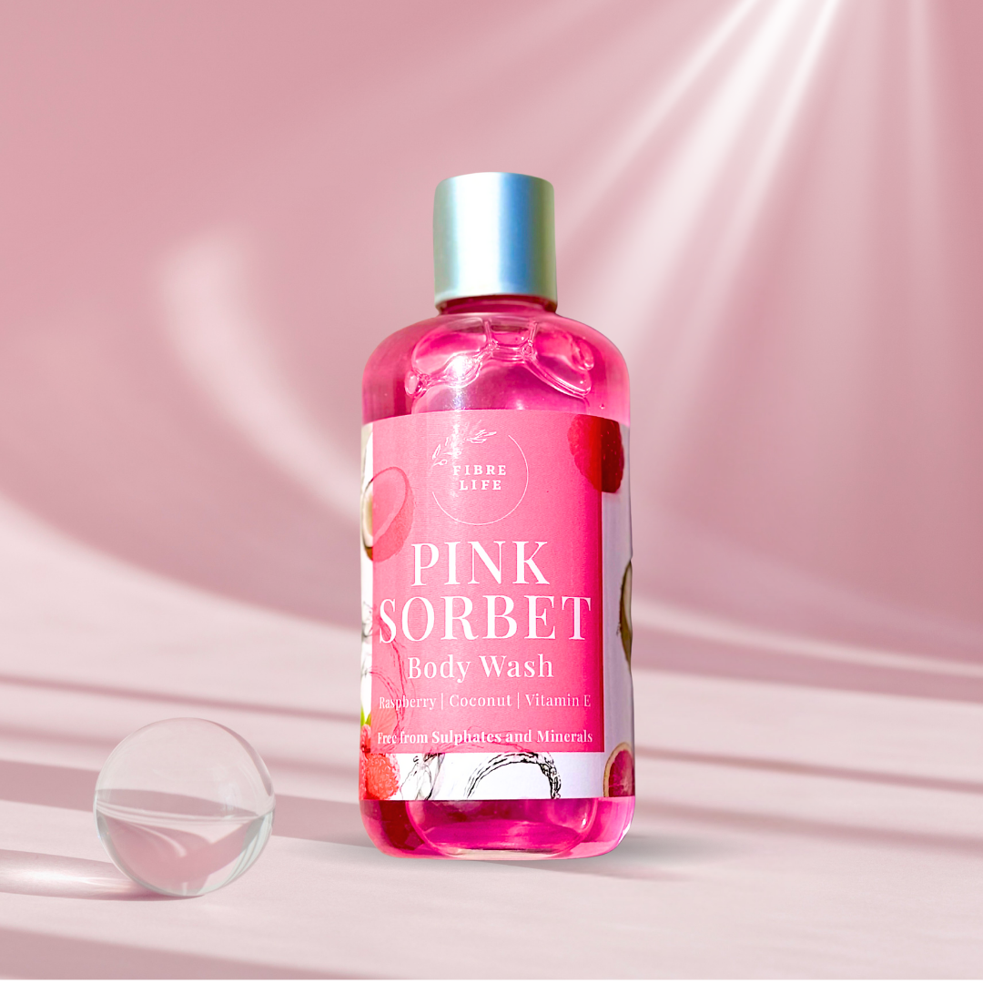 Pink Sorbet body wash bottle on a pink background