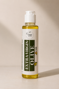 A bottle of Fibre Life Extra Virgin Olive Oil with a white cap and a white label featuring dark green text, set against a warm beige background with soft shadows.