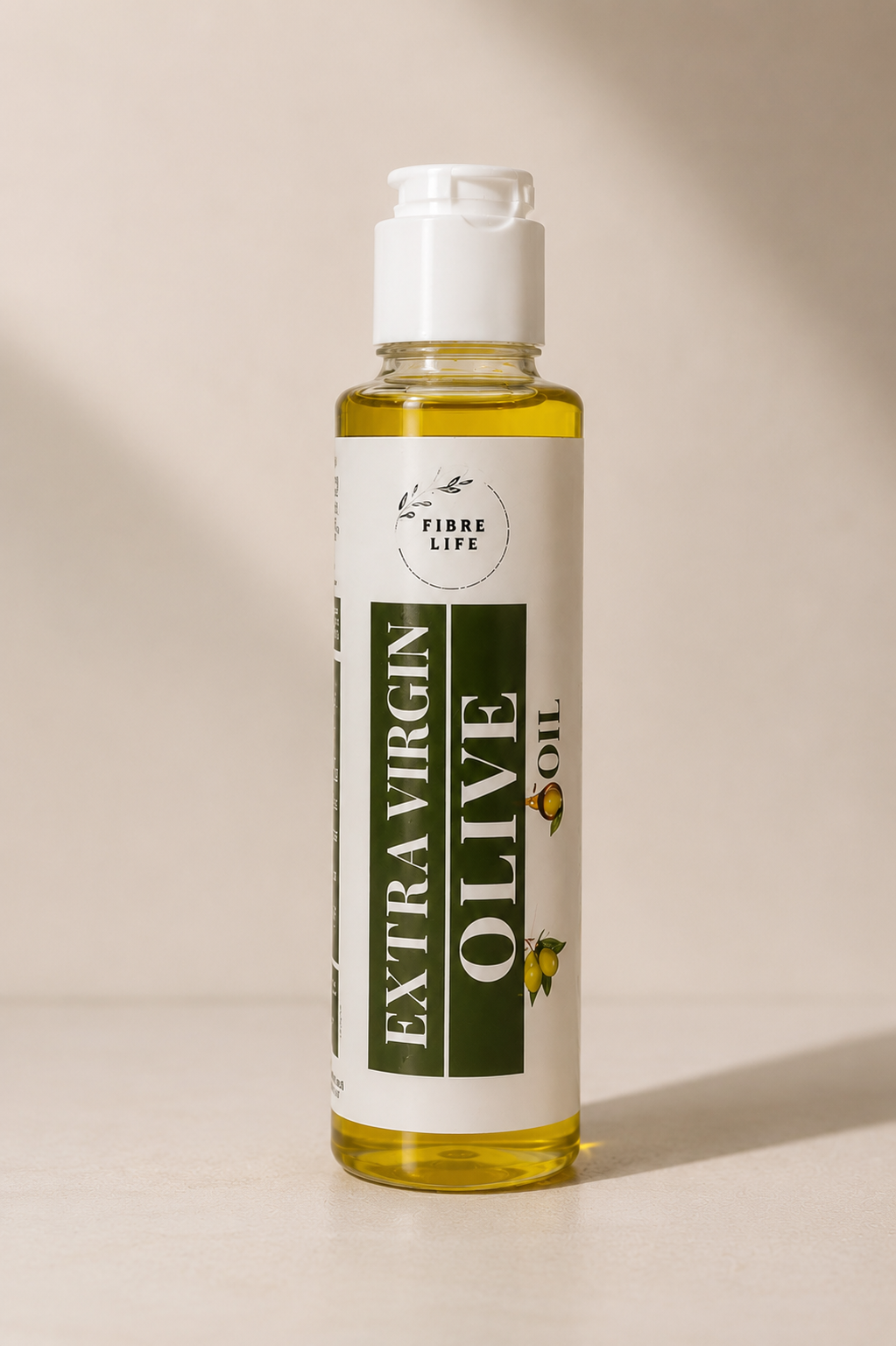 A bottle of Fibre Life Extra Virgin Olive Oil with a white cap and a white label featuring dark green text, set against a warm beige background with soft shadows.