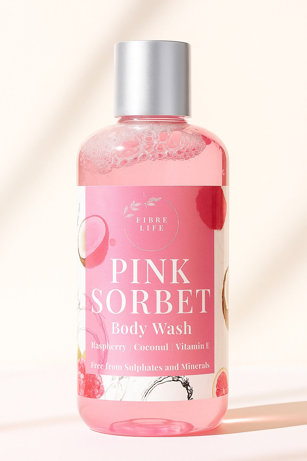 Pink sorbet body wash bottle with silver cap on a beige background. best body wash in pakistan