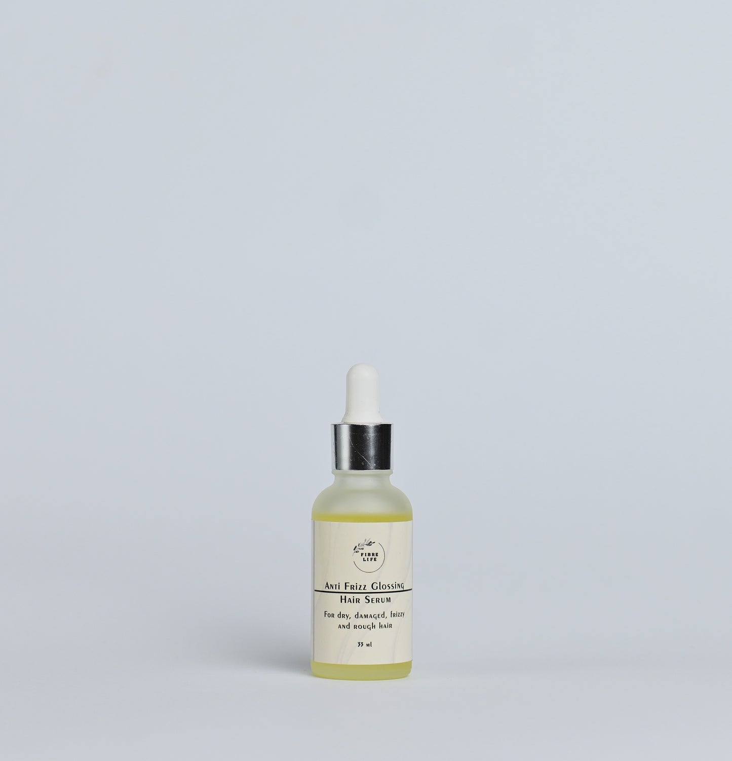 Lightweight hair serum reduces frizz, adds shine, and protects against humidity.