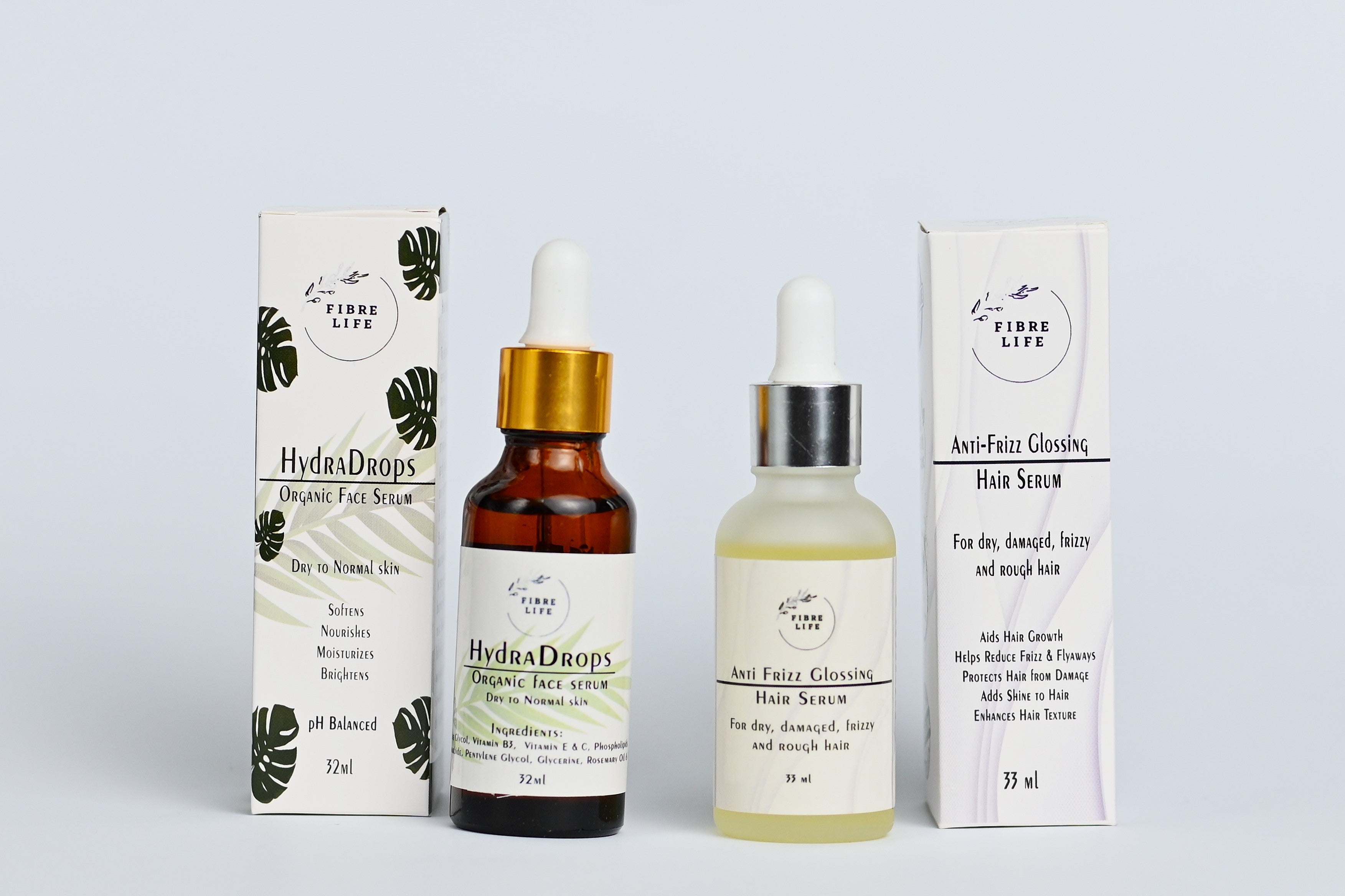 Anti-frizz hair serum and brightening face serum duo for deep hydration and damage repair.