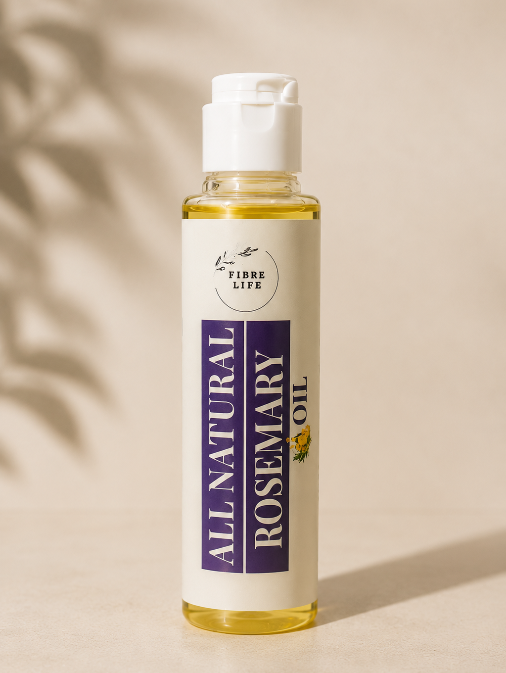 A bottle of FibreLife All Natural Rosemary Oil with a white label and white cap, standing on a beige surface with soft leaf shadows.